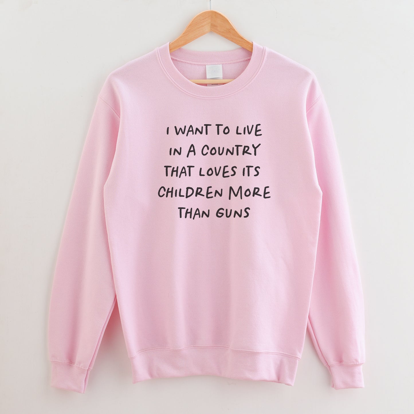 I Want to Live in a Country that Values it's Children More Than Guns Sweatshirt